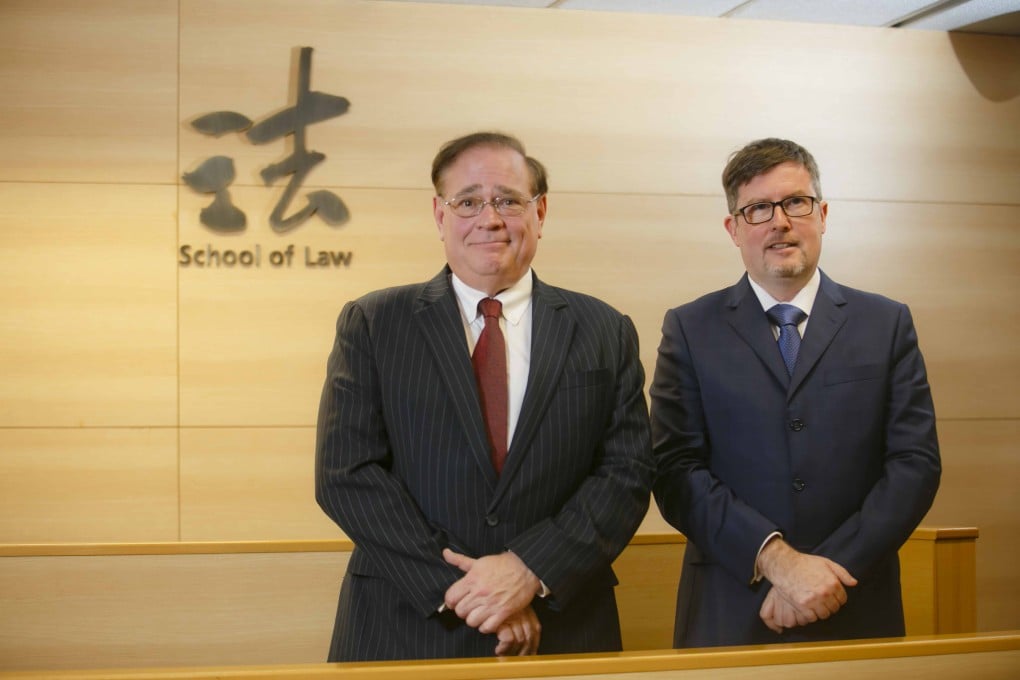 Dr Mark Kielsgard, Director of Mooting (left) and Mr David Holloway, Associate Director of Mooting