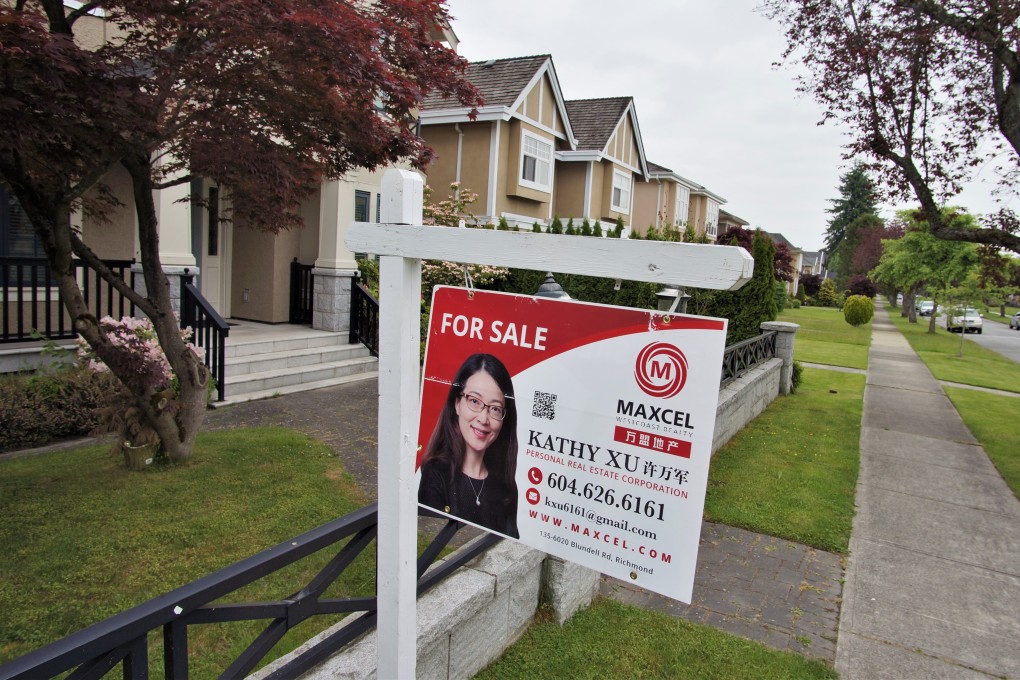 A “for sale” sign outside a Vancouver home being marketed by Kathy Xu, a director of Maxcel Westcoast Realty. Photo: Ian Young