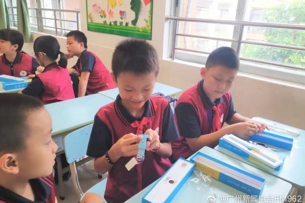 In 10 years, he probably won’t look as thrilled about the idea of constant surveillance. (Picture: Guangzhou News Radio FM962 via Weibo)