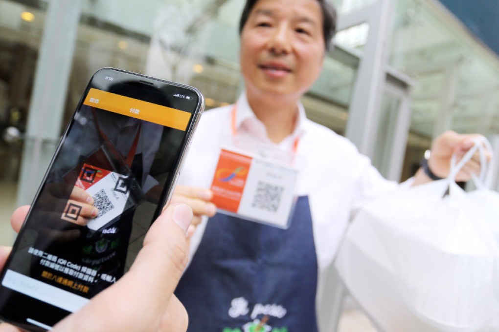 Whether ordering food or buying a movie ticket, giving up some private information has become routine when using mobile payments. (Picture: Dickson Lee/SCMP)