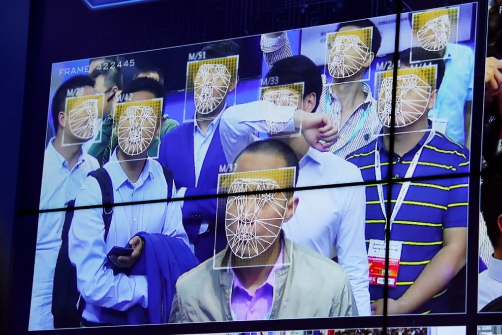Facial recognition cameras now standard in China's southern tech hub of Shenzhen. Here Chinese AI company Megvii shows off its facial recognition at a Shenzhen security expo. (Picture: Bobby Yip/Reuters)