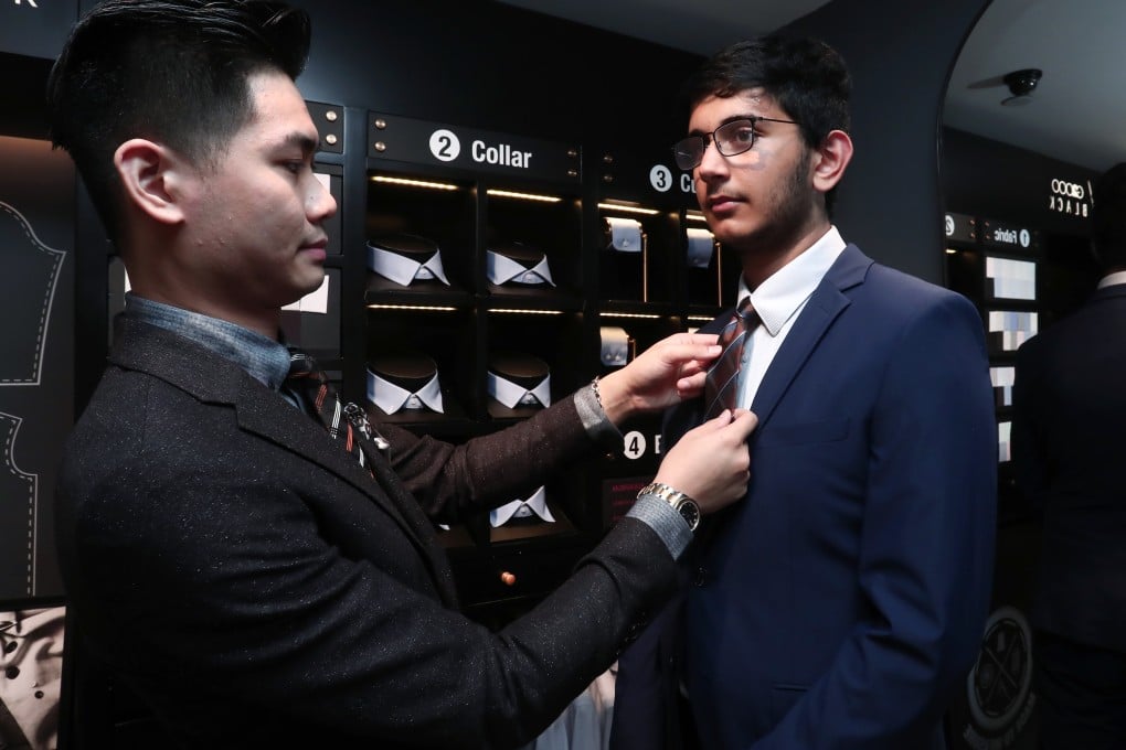 Young Post cadet Neel Chawla tries on a suit at G2000 Black.