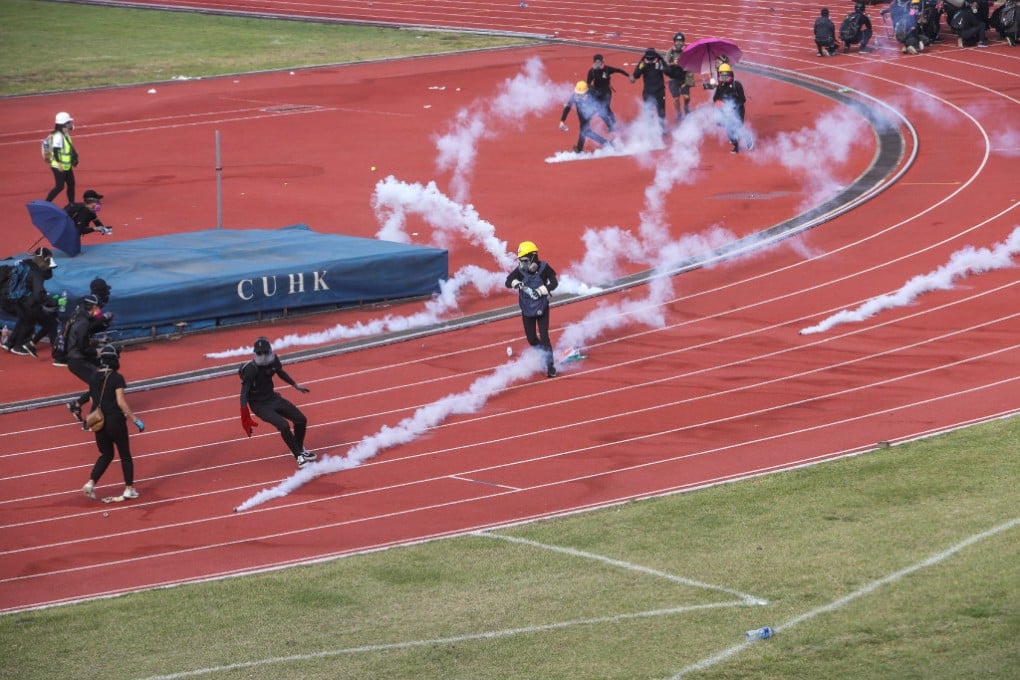 Clashes erupt between anti-government protesters and riot police as tear gas is fired into the campus of the Chinese University of Hong Kong. (Picture: Winson Wong/SCMP)