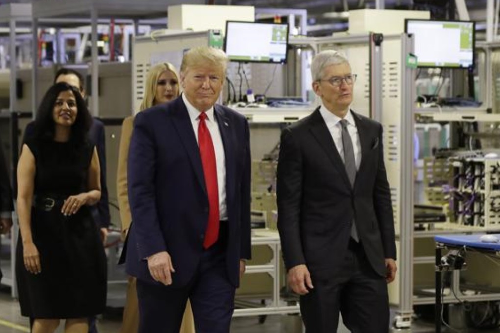 President Donald Trump tours an Apple manufacturing plant in Austin, Texas with Apple CEO Tim Cook on Wednesday. (Picture: Evan Vucci/AP Photo)