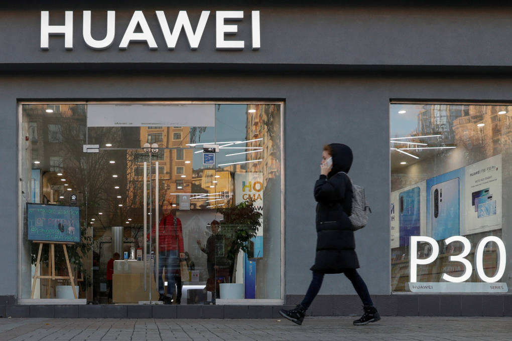 A woman walks past a Huawei store in central Kiev, Ukraine, on November 11, 2019. (Picture: Valentyn Ogirenko/Reuters)