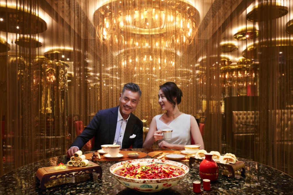 An exceptional experience with chandeliers shimmering against auspicious shades of red and gold