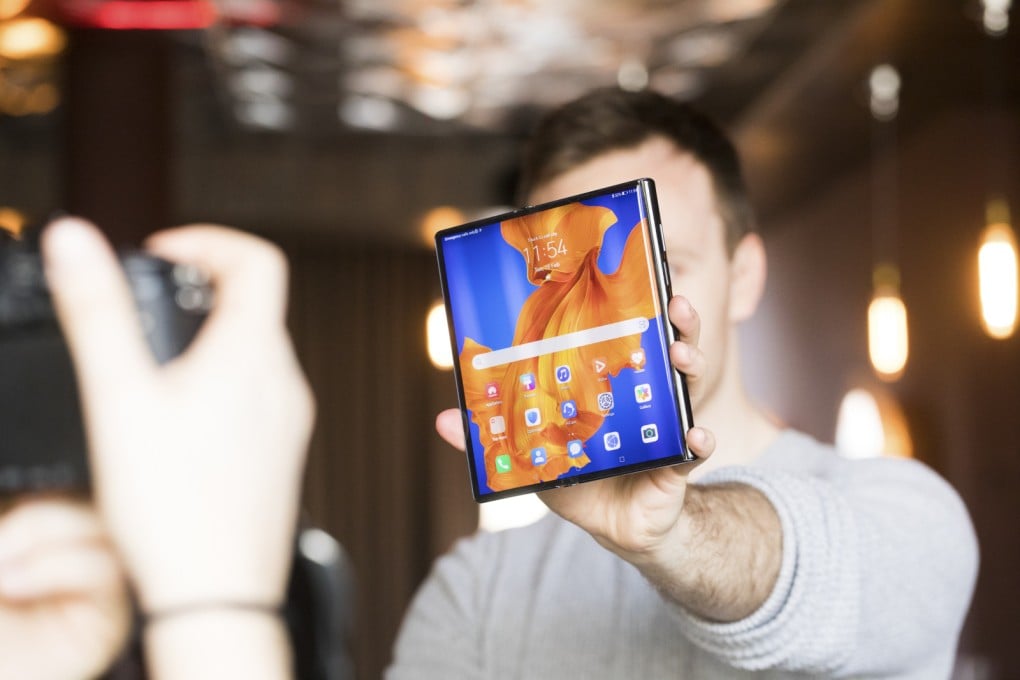 An attendee holds an unfolded Huawei Mate Xs at a London launch event on February 18. (Picture: Chris Ratcliffe/Bloomberg)