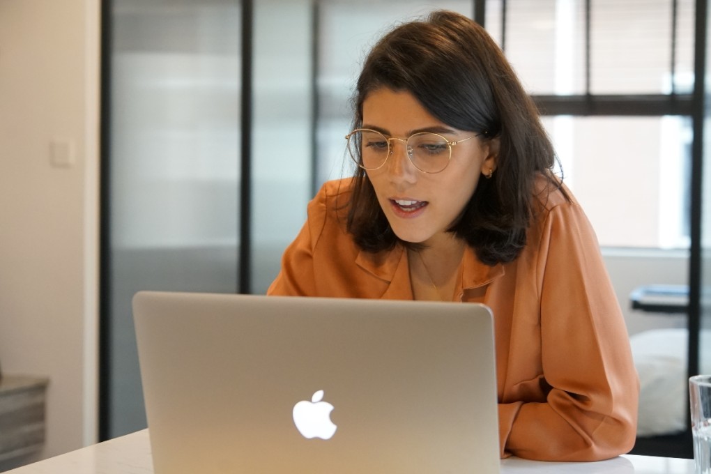 A YCIS teacher gives an online lesson via Zoom at home