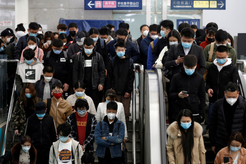 Passengers inside a subway station during morning rush hour in Beijing on April 7. Apple Pay has been available on public transport in the capital and Shanghai since 2018. (Picture: Tingshu Wang/Reuters)