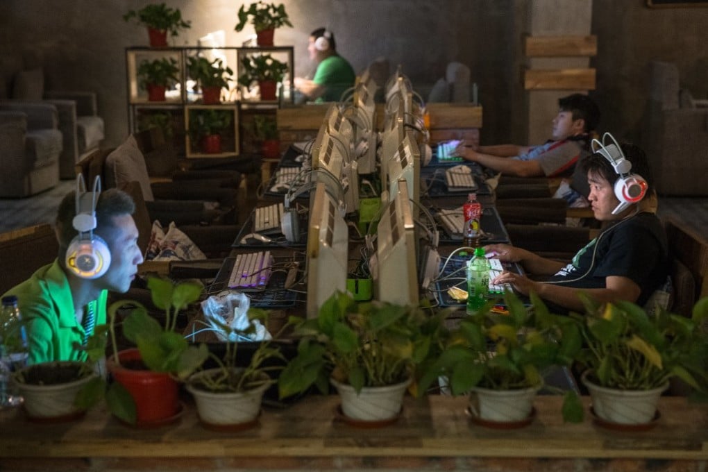 Customers at an internet cafe in Beijing on May 31, 2017. (Picture: Roman Pilipey/EPA)