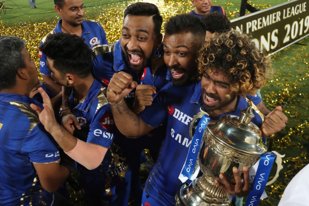 Mumbai Indians celebrate their win in the final cricket match of the Indian Premier League in 2019 with a trophy decorated with Vivo-branded ribbons. (Picture: Mahesh Kumar A./AP Photo)