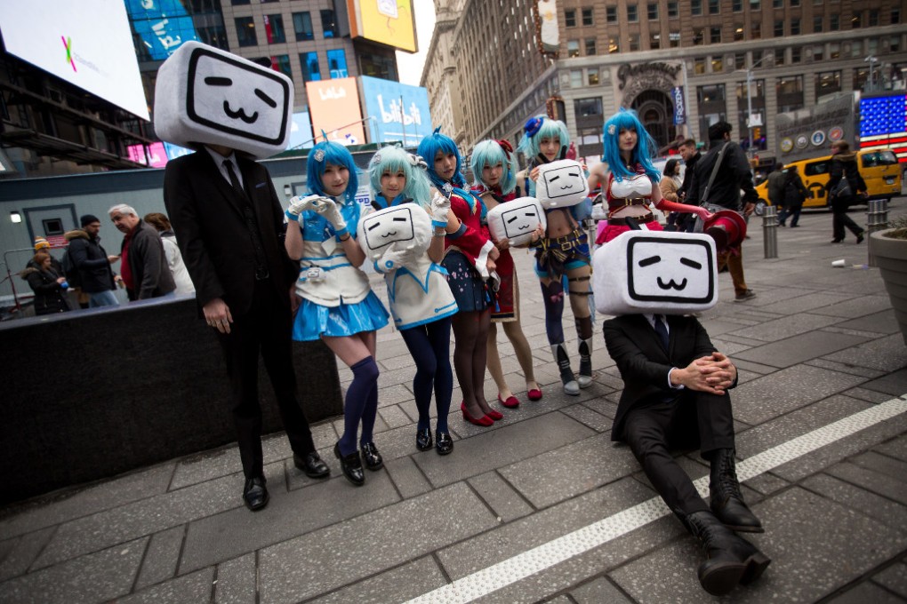 Cosplayers holding Bilibili logos outside the Nasdaq MarketSite in New York in March 2018, when Bilibili went public. (Picture: Bloomberg)