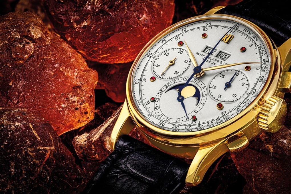 Leading Christie’s Patek Philippe ‘The Ruby Series’ sale is the 18K Gold Perpetual Calendar Chronograph Wristwatch featuring Charles Stern’s Unique Dial with Cabochon Ruby Hour Markers, ref. 1518.