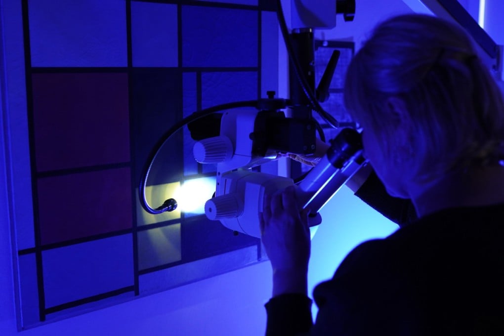 A conservator at Fondation Beyeler researching a Mondrian masterpiece.