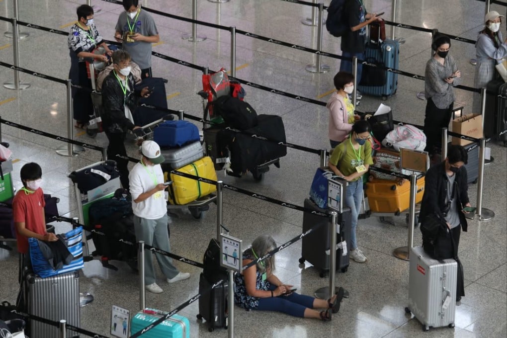 Arrivals queue at Hong Kong’s airport to be sent to designated quarantine hotels under one of the world’s strictest pandemic policies. Photo: Yik Yeung-man