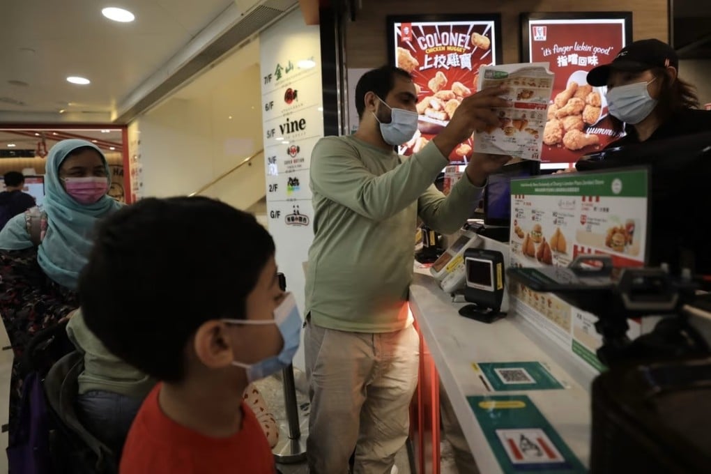 A Muslim family gets their first taste of KFC at the halal-certified branch at Chuang’s London Plaza in Jordan. Photo: Xiaomei Chen