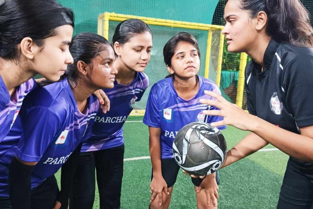 Kulsum Shaikh trains young girls how to play football in Mumbra, India. Photo: Kunal Purohit