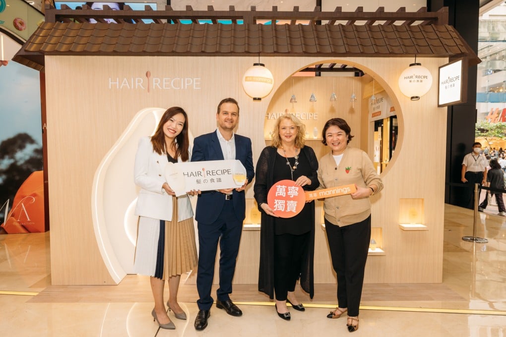 Michel VanCauwenberge, Senior Sales Director, P&G Hong Kong & Macau (second from left), and Elisabeth Van Den Berkmortel, Mannings’ Commercial Director - Health & Beauty Hong Kong & Own Brand Health & Beauty (second from right), officiate at the opening ceremony.