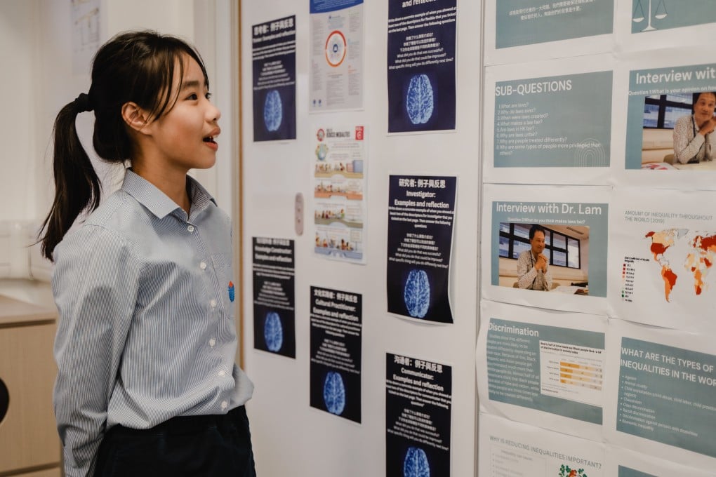 A Year 7 student is explaining her project initiatives to the guests on the Open Day.