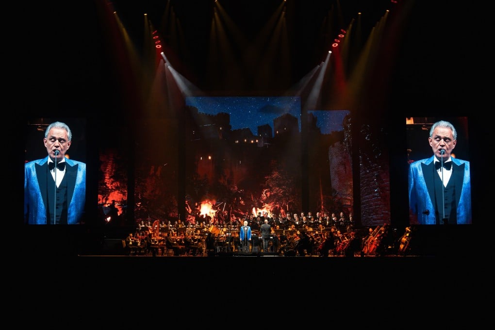 Andrea Bocelli commands the Galaxy Arena stage set against a cinematic backdrop that transforms the venue into a world of musical enchantment.