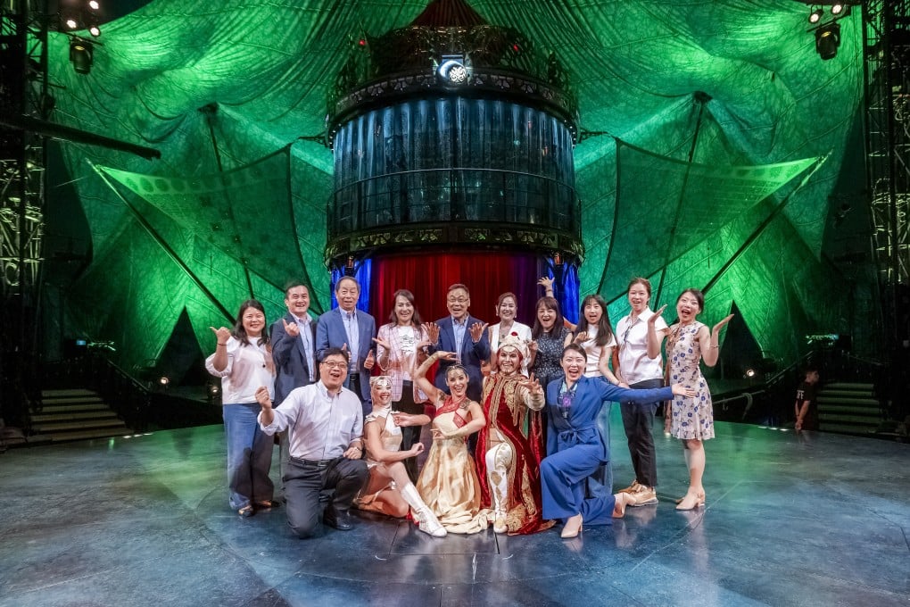 Spreading smiles in Hong Kong: (back row, fifth from left) Mr Vincent Lam, founder of the Lam Kwun King Memorial Fund, with representatives from NGOs and performers of Cirque du Soleil KOOZA.