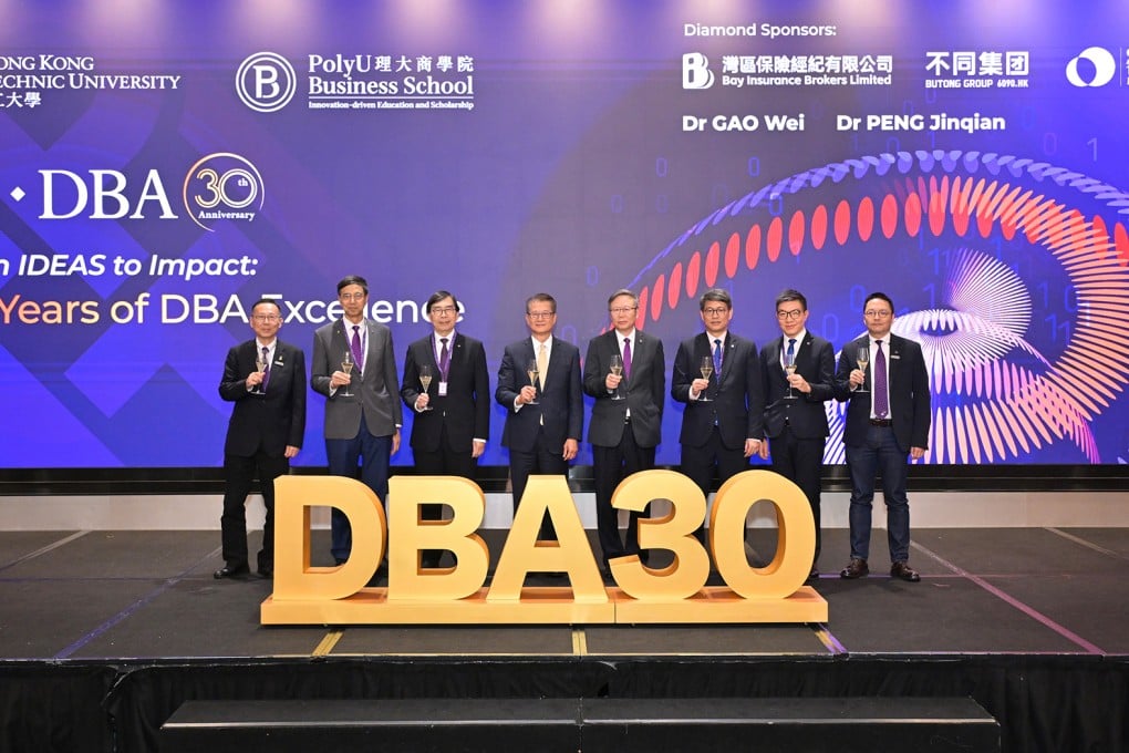The PolyU Faculty of Business hosted a grand dinner on 14 May to celebrate the 30th anniversary of its DBA programme. In attendance were: Mr Paul Chan, Financial Secretary of the HKSAR Government of the People’s Republic of China (4th from left); Prof. Jin-Guang Teng, PolyU President (4th from right); Prof. Christopher Chao, Senior Vice President (Research and Innovation) (3rd from right); Dr Ben Lau, PolyU Interim Vice President (Campus and Facilities) (2nd from right); Prof. Geoffrey Shen, PolyU Associate Vice President (Global Partnerships) (2nd from left); Ir Prof. Edwin Cheng, Dean of the PolyU Faculty of Business (3rd from left); Prof. Yick-hin Hung, PolyU DBA Programme Director (1st from left); and Prof. Raymond Wong, PolyU DBA Deputy Programme Director (1st from right).