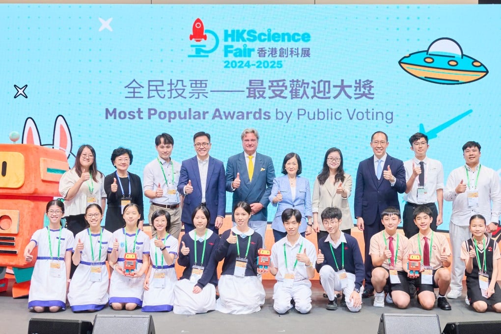 Student teams honoured with the Most Popular Awards by Public Voting celebrated with organisers and guests at the Hong Kong Science Fair last year.