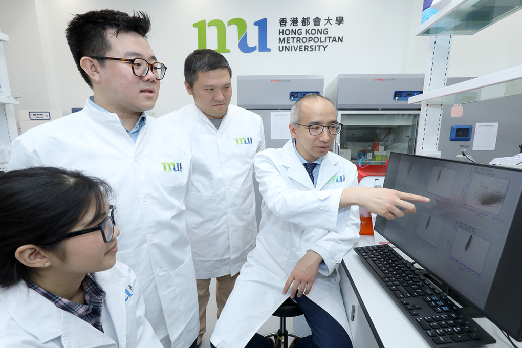 Prof. Jack Tang Wai-ho (far right) and his team decode the biomolecules in cancer progression.