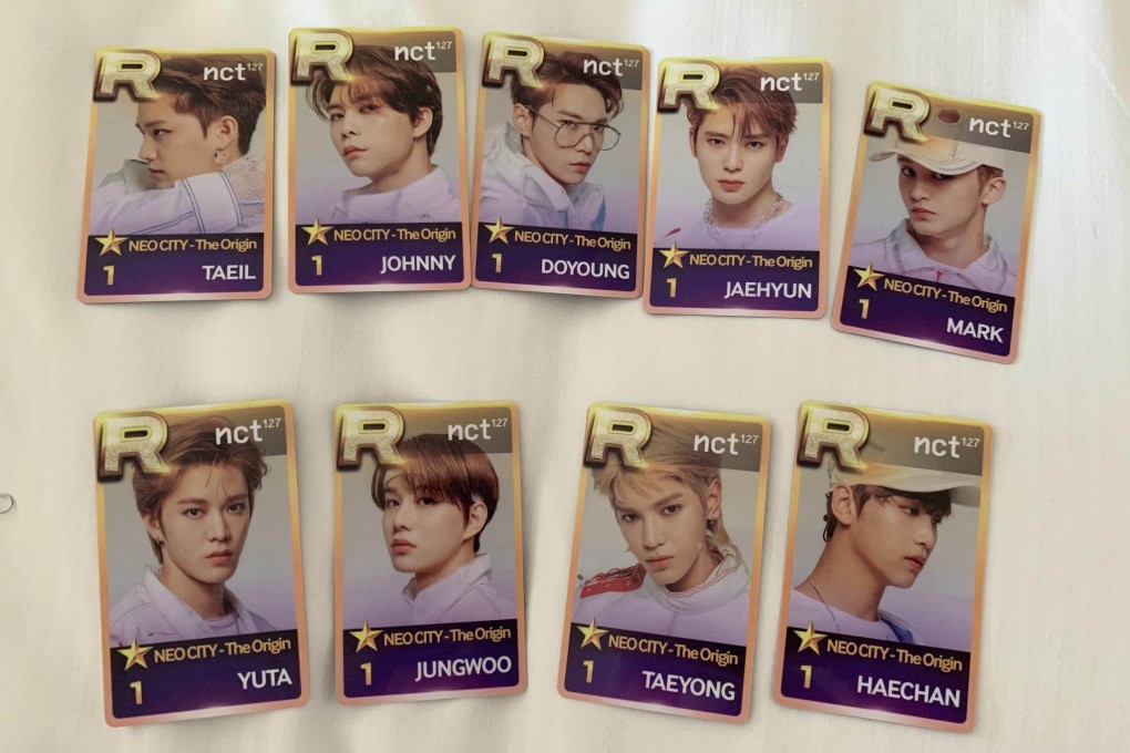 Photocards featuring NCT 127. K-pop fans are keeping the spirit of buying, selling and trading cards alive with pint-sized photos of K-pop stars they can put in their wallets.