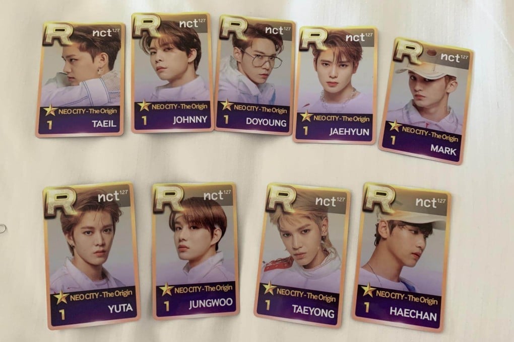 Photocards featuring NCT 127. K-pop fans are keeping the spirit of buying, selling and trading cards alive with pint-sized photos of K-pop stars they can put in their wallets.