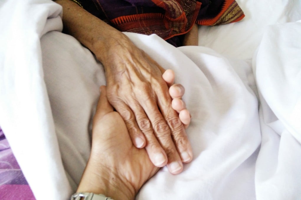 Ranjini Rao holds her mother’s hand, who died from cancer in 2016. Photo: Ranjini Rao