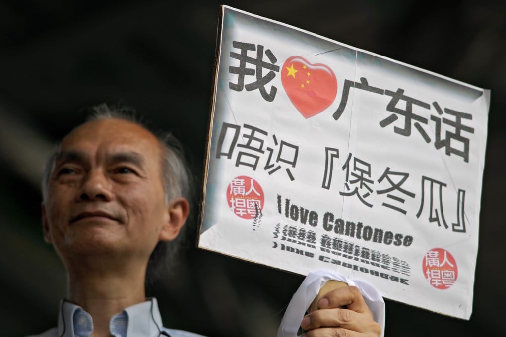 A man carries a sign saying: “I love Cantonese”. With more than 80 million speakers globally, it remains a vital and useful language. Photo: AFP