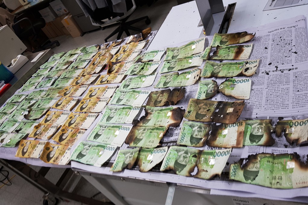 The Bank of Korea displays damaged banknotes that were heated up in a microwave because of concerns over the coronavirus on July 31, 2020. Worries over inflows of hot money have led some central banks in Asia to retract policy support and enact measures to curb rising asset prices. Photo: AP