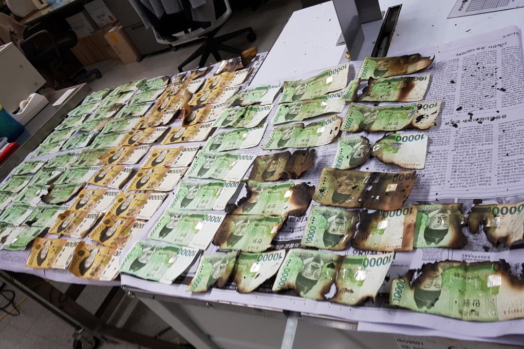 The Bank of Korea displays damaged banknotes that were heated up in a microwave because of concerns over the coronavirus on July 31, 2020. Worries over inflows of hot money have led some central banks in Asia to retract policy support and enact measures to curb rising asset prices. Photo: AP