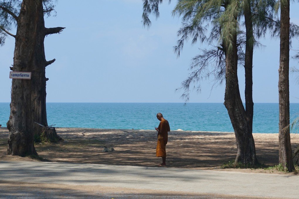 A Buddhist monk stands on a beach in Khao Lak in Thailand. Just 6.7 million travellers visited Thailand last year, down from 40 million in 2019. Photo: Getty Images