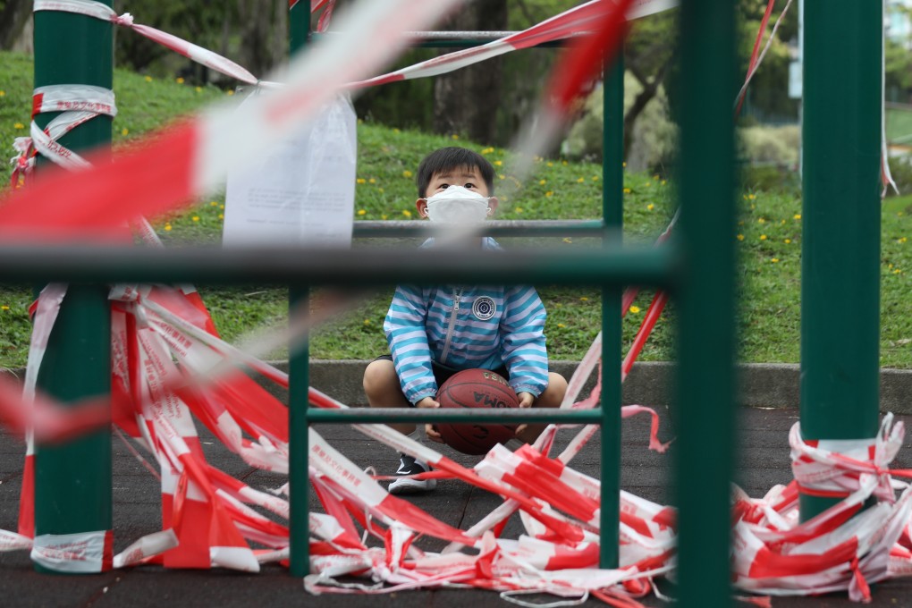 A boy looks wistfully at a cordoned-off playground in Kowloon City on April 25, 2020. Public playgrounds have been a casualty of the government’s coronavirus prevention measures. Photo: Xiaomei Chen