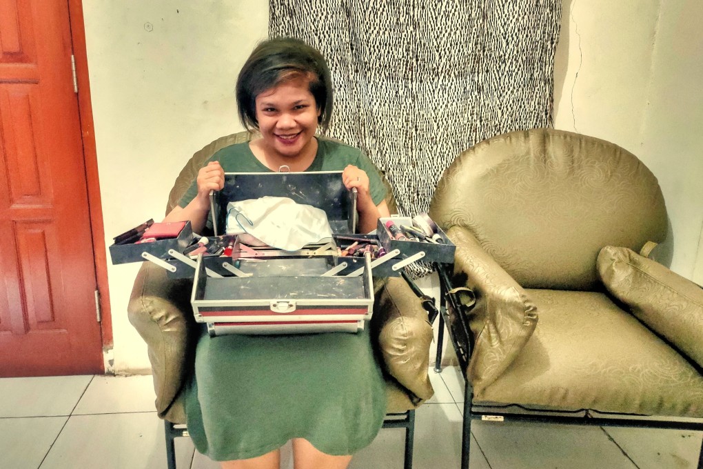 Mortuary make-up beautician Gloria Elsa Hutasoit at home with her beauty tool case. Photo: Sylviana Hamdani