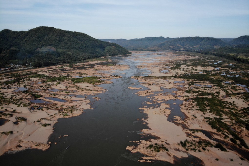Climate breakdown is becoming a grim reality. The once mighty Mekong river has been reduced to a thin, grubby neck of water across northern Thailand. Photo: Lillian Suwanrumpha/AFP