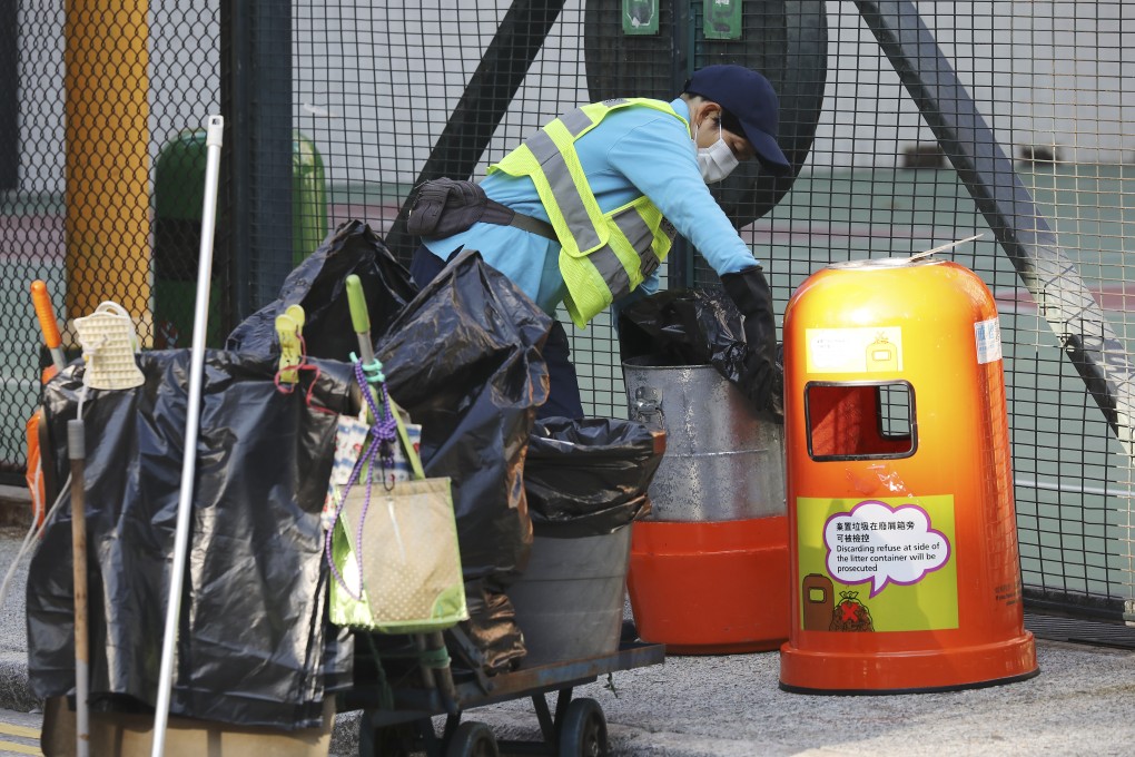 A cleaner at work in Yau Ma Tei district of Kowloon. Cleaners will be among Hong Kong’s lowest-paid workers hit by the minimum wage freeze. Photo: Nora Tam