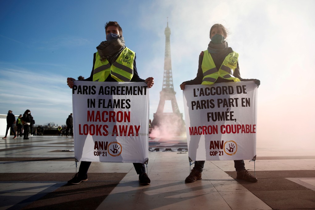 Climate activists demonstrate in front of the Eiffel Tower to mark the fifth anniversary of the 2015 UN Paris agreement on climate change, in Paris on December 10 last year. Slowing global warming is one of the key goals of the 2030 agenda. Photo: Reuters