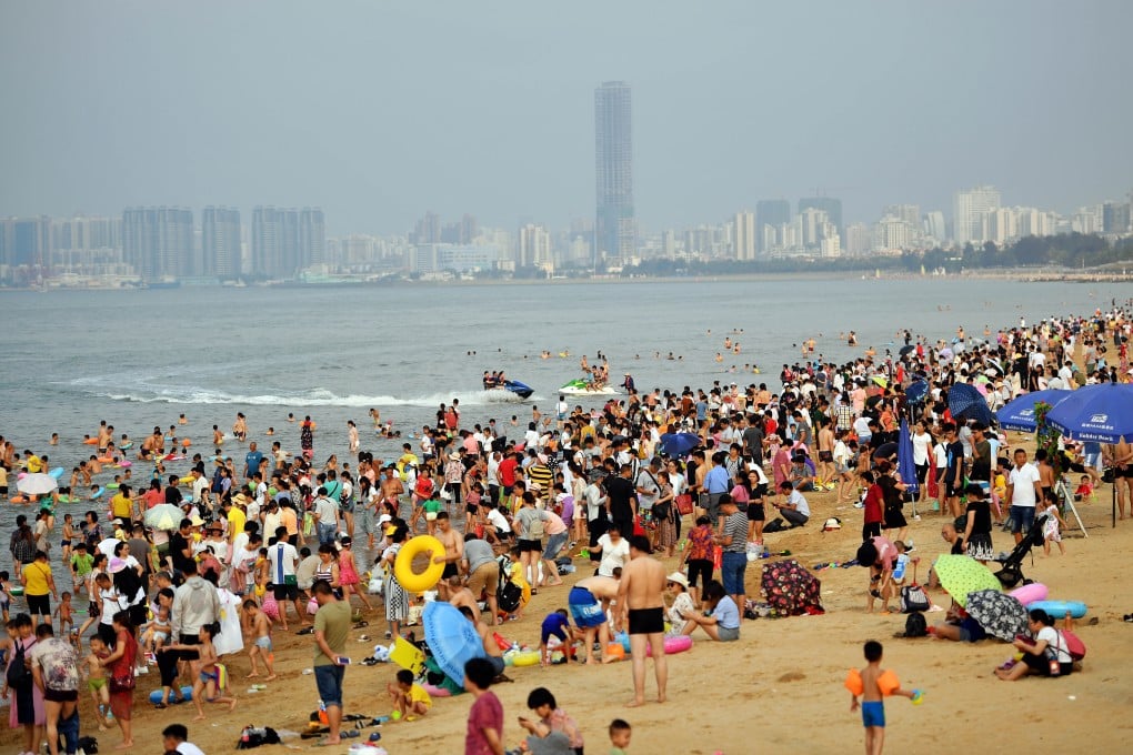 Tourists on a beach in Haikou, the capital of China’s Hainan province. Photo: Xinhua