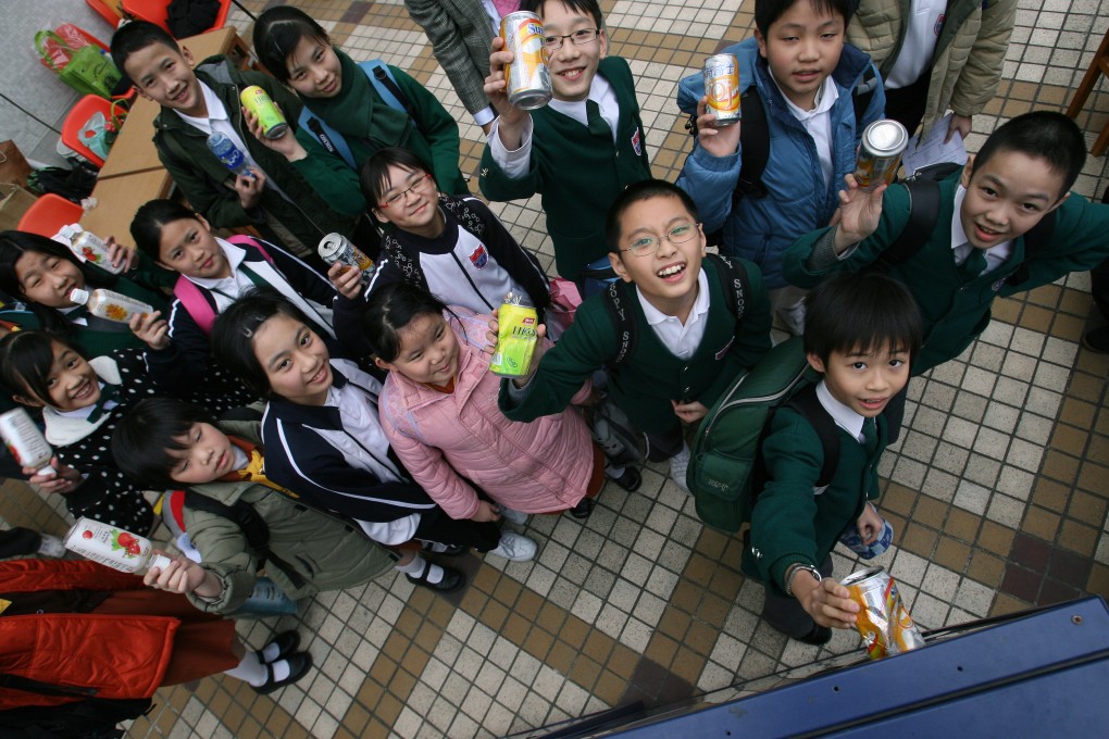 Hong Kong children ready to feed aluminium cans and plastic bottles into a reverse vending machine back in 2007. Many such initiatives have been launched in Hong Kong for many years.