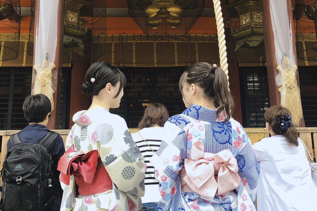 Emi Izawa (right) and a friend at a Kyoto temple, clad in rented kimonos. With borders still closed to outsiders, rental firms are replying more heavily on locals, and there is a renewed interest in kimono-wearing among young people. Photo: Handout