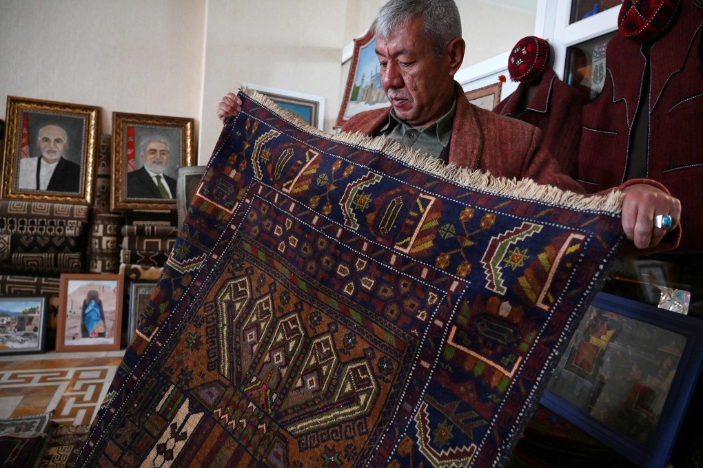 A vendor displays a rug at his shop in Bamiyan, Afghanistan. Photo: AFP