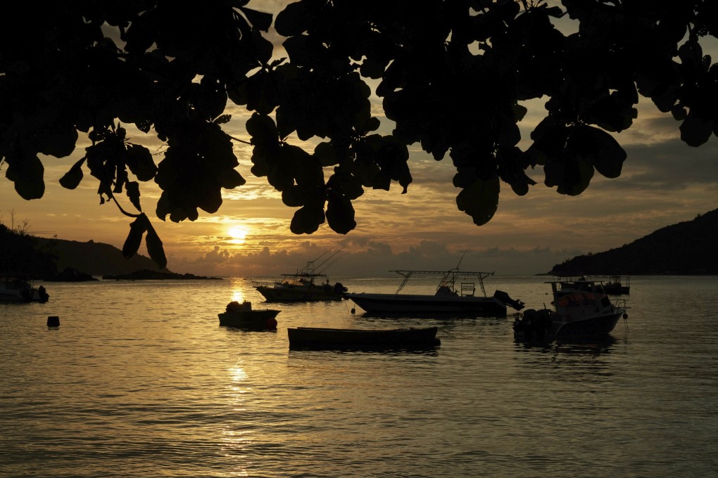 Boats at anchor off Mahe island, Seychelles. The Indian Ocean island nation aims to reach “herd immunity” this month. Photo: AP