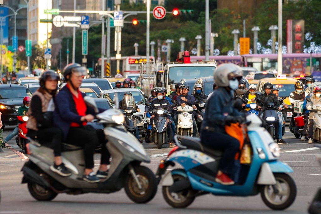 A busy intersection at a shopping district in Taipei on  February 23. Taiwan has revised its economic growth forecast upwards for 2021, despite the Covid-19 pandemic. Photo: EPA-EFE
