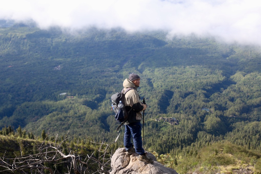 “People always underestimate this mountain,” says Wayan Dartha, a guide who takes visitors to the top of active volcano Mount Agung, in Bali. Photo: Ian Neubauer