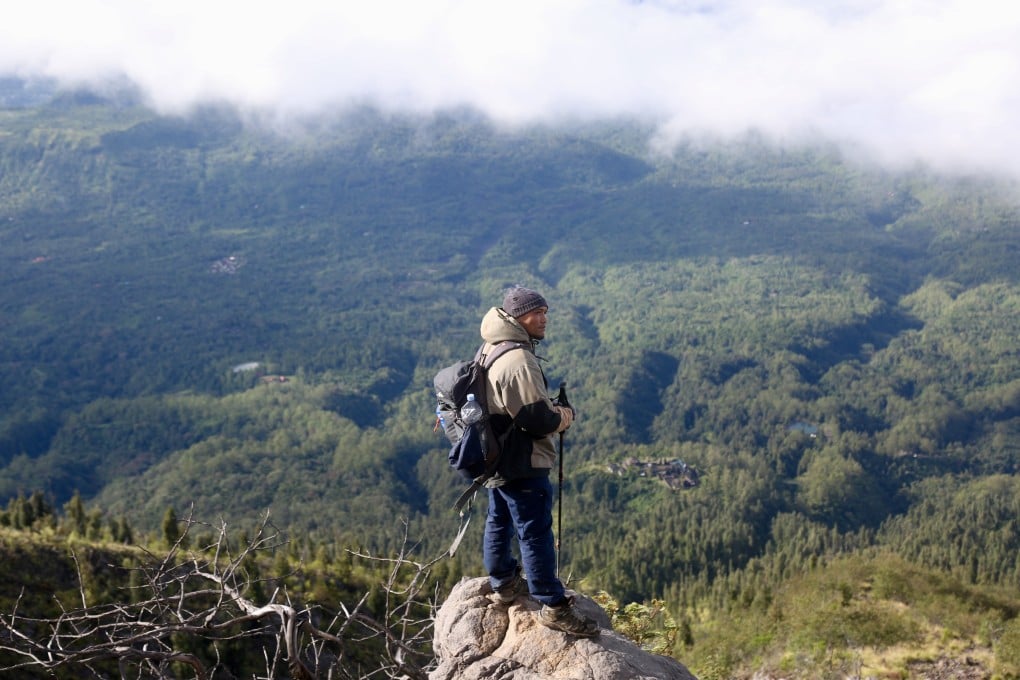 “People always underestimate this mountain,” says Wayan Dartha, a guide who takes visitors to the top of active volcano Mount Agung, in Bali. Photo: Ian Neubauer