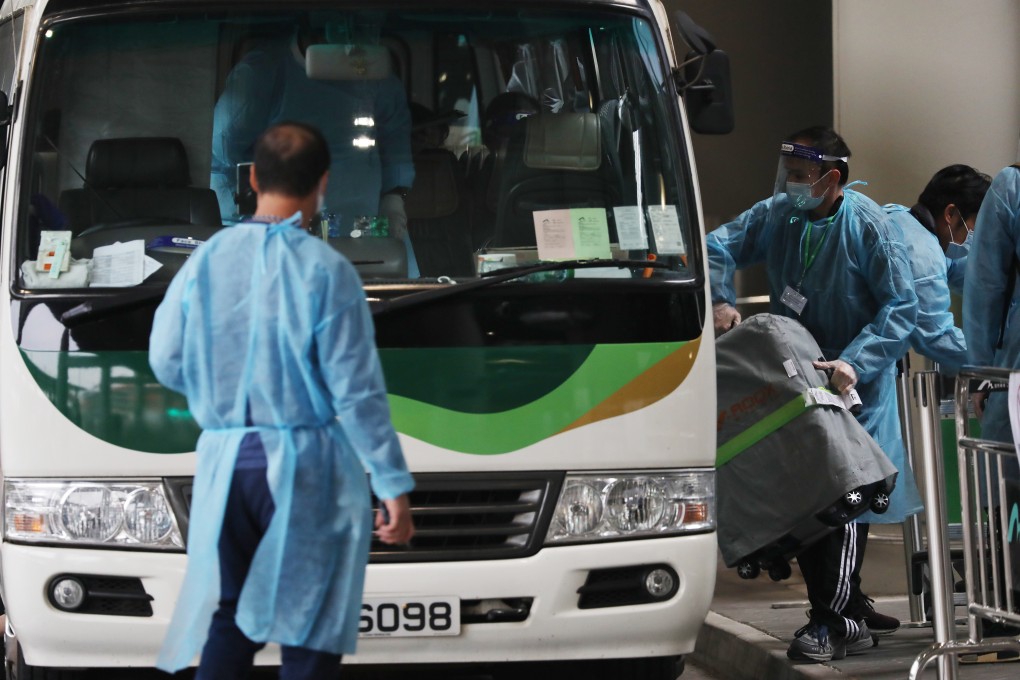 Passengers arriving at the Hong Kong International Airport prepare to be transported to designated quarantine hotels on December 22. Hong Kong extended its compulsory quarantine to three weeks for almost all international travellers from December 25. Photo: Nora Tam