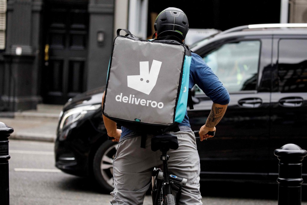 A Deliveroo food courier makes a delivery in central London on September 11, 2019. The online food delivery company has chosen London for its public listing. Photo: Agence France-Presse